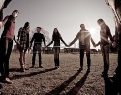 People holding hands in a group